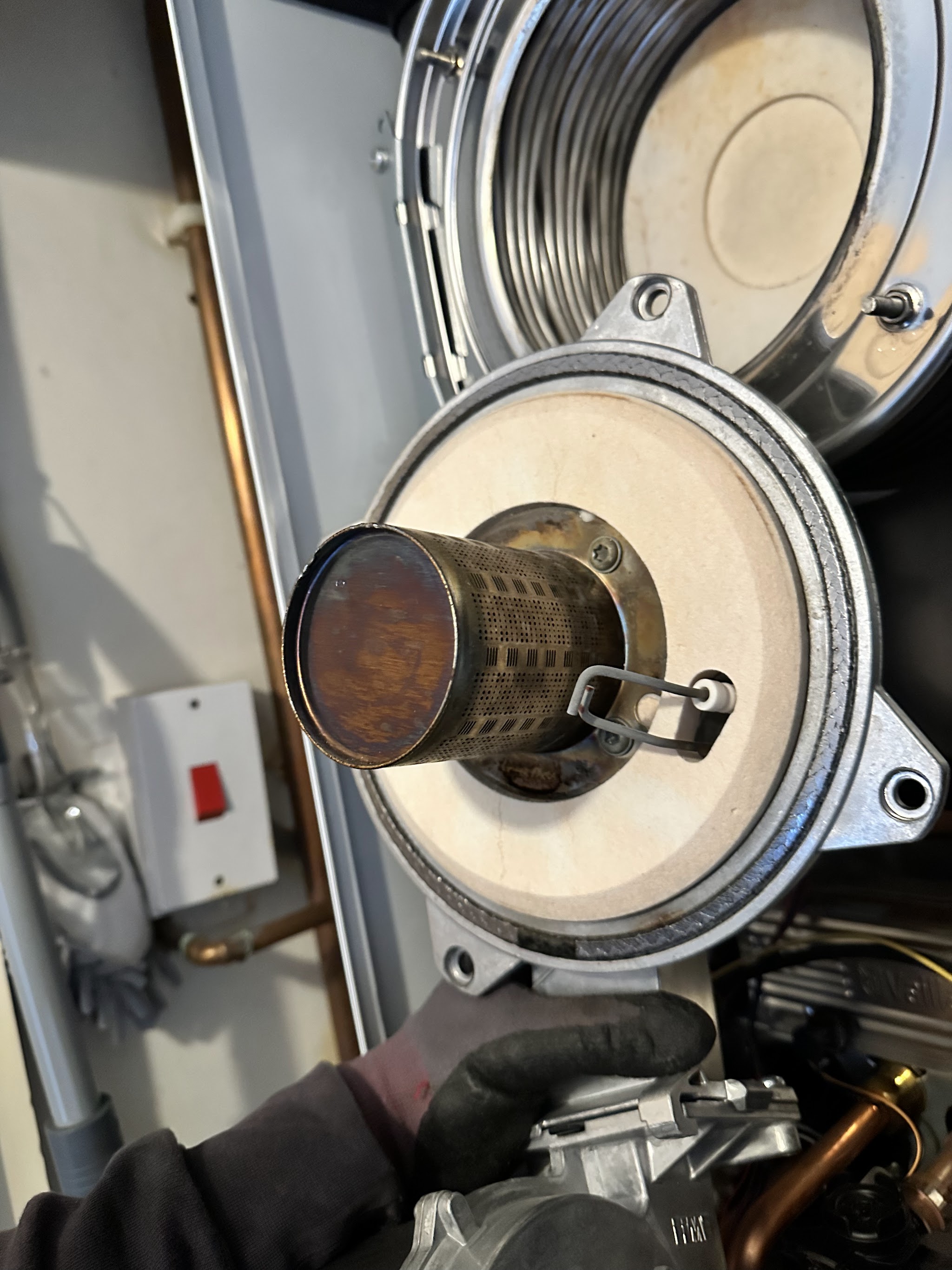 The burner and fan assembly taken out of a boiler during a service