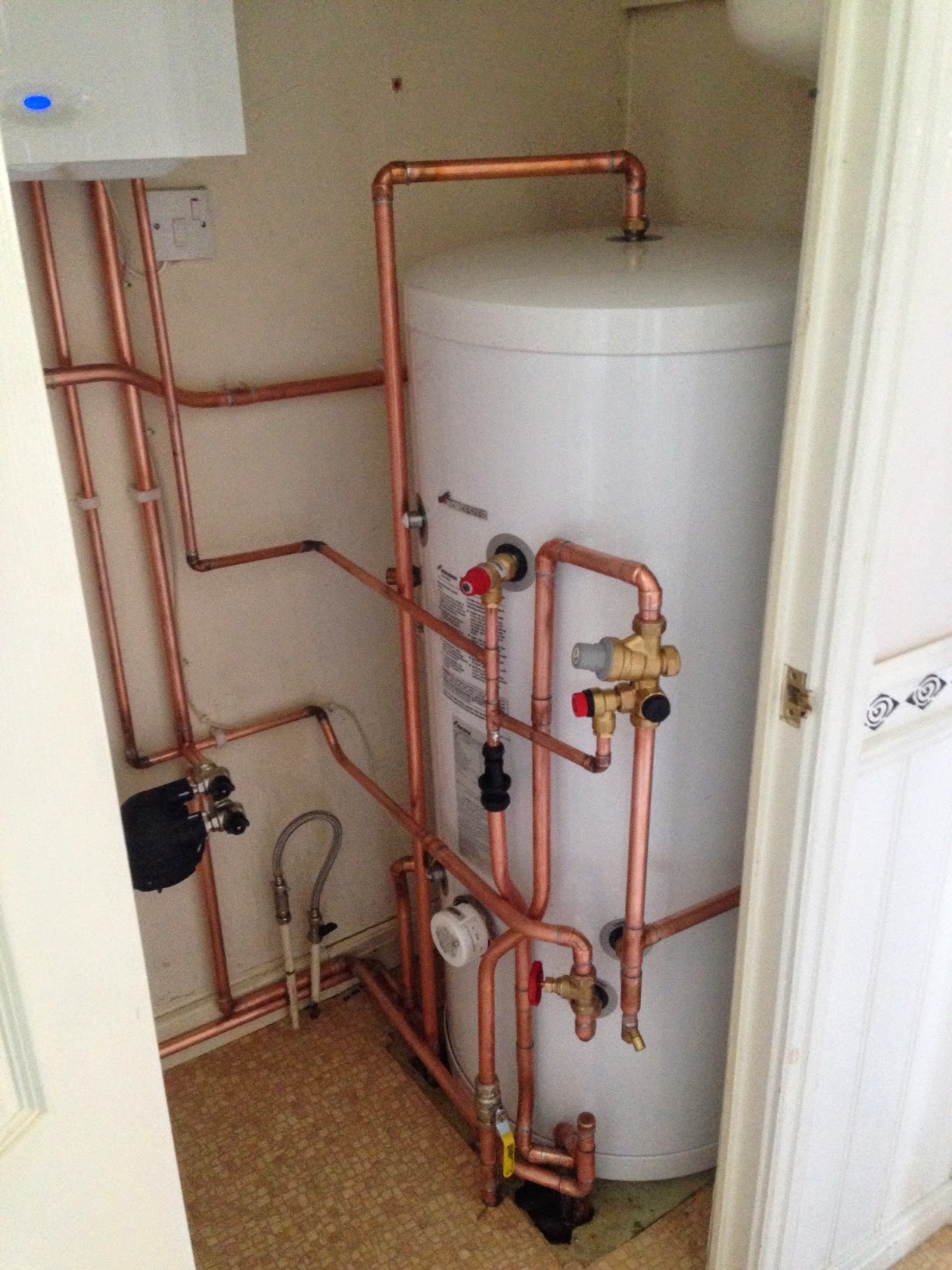 An unvented hot water cylinder we installed with new copper pipework
